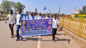 Tiptur: Ambedkar Seva Samiti demands underpass service road and bus stop.